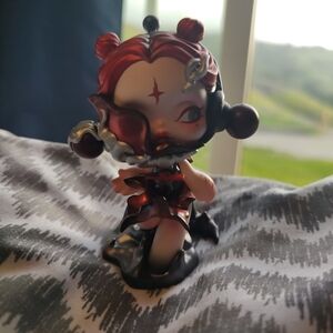 Red and Black Figurine